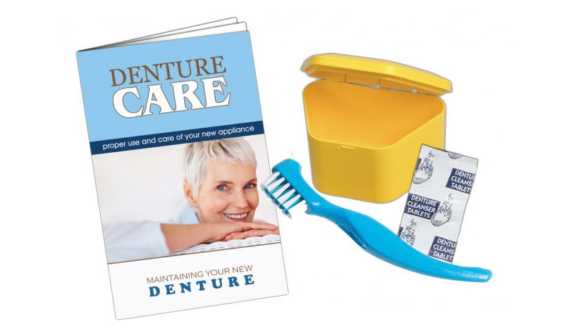Denture care booklet, denture box, denture cleaning brush and denture tablets